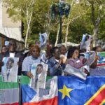 Group from Equatorial Guinea protesting French investigation of their President and Vice President