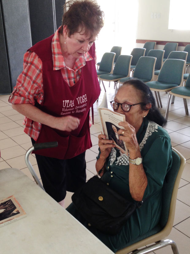 A woman is finally able to read with new glasses donated by Utah residents