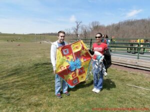 Ambassador Karran with a family at the kite flying event in the Washington DC Metro area