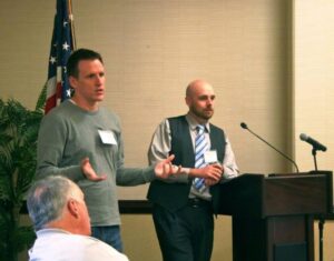 Returned Volunteers Scott Stadum and Shane Loorz addressing the gathering