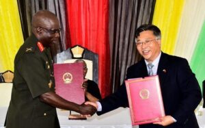 Ambassador of the PRC to Guyana, Mr. Cui Jianchun performs ceremonial handing over of documents to Chief of Staff of the GDF