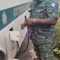 Member of Guyana Defence Force (GDF) allegedly siphoning fuel from vehicle