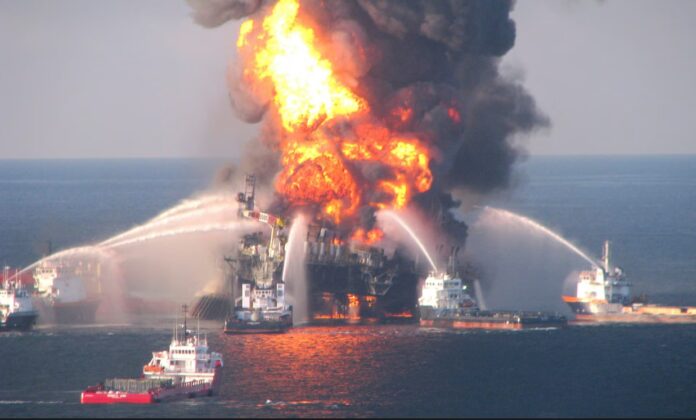 Fire boat response crews battle the blazing remnants of the offshore oil rig Deepwater Horizon off Louisiana on 21 April 2010. Photograph: Handout/Reuters